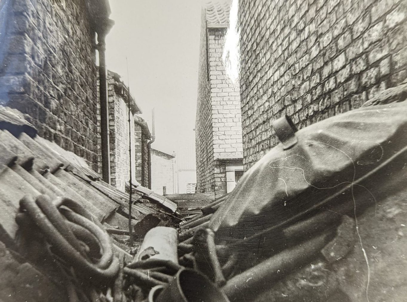Dustbin Lid on a roof on a house down Groves Lane 1950.